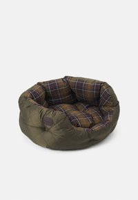 Round pet bed with olive quilted exterior and brown, red, and white plaid padded interior cushioning against a white background.