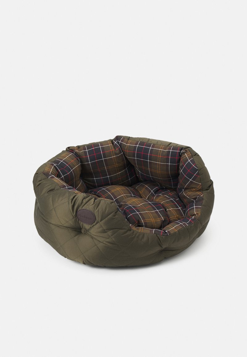 Round pet bed with olive quilted exterior and brown, red, and white plaid padded interior cushioning against a white background.