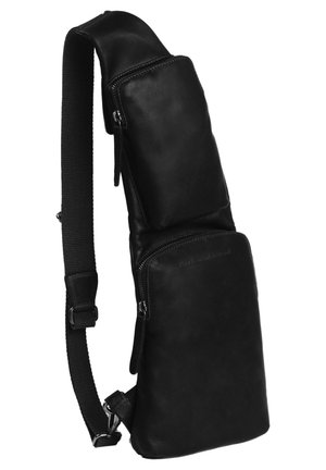 Sac en cuir noir en bandoulière avec une texture lisse, comportant deux compartiments zippés, une sangle rembourrée et un design élégant et angulé.
