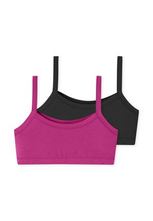 Zwei nahtlose Bralettes aus weicher Baumwollmischung mit dünnen Trägern, ein magentafarbenes vor einem schwarzen liegend auf weißem Hintergrund.