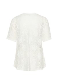 Maglietta bianca a maniche corte con un intricato motivo in pizzo floreale e bordi ondulati, caratterizzata da una vestibilità comoda e un collo rotondo.