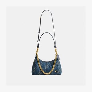Small blue quilted denim shoulder bag with gold chain and leather straps, featuring a gold brand logo and a leather tag.