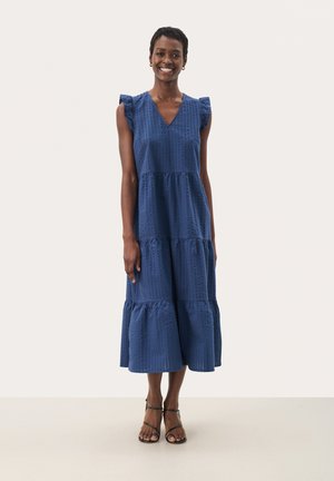 Blue midi dress with a V-neck, ruffled shoulder details, tiered design, textured material, and a loose, flowing fit.