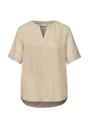 Blouse beige à manches courtes avec fente en V, col rond, poignets pliés et ourlet légèrement incurvé, adaptée pour un usage décontracté ou professionnel.
