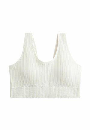 Ribbad vit bralette med breda remmar och texturerad band. Har en rundad halsringning och en figurnära design för stöd och komfort.