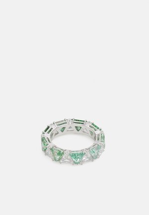 Green gemstone ring featuring triangular and rectangular cuts, set in a silver-tone band with an openwork design.
