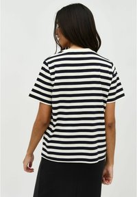 Black and white striped T-shirt with short sleeves, round neckline, and a loose fit, made from a soft, breathable fabric.