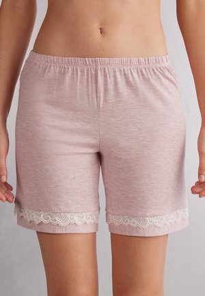 Lichtroze katoenen shorts met een elastische tailleband, voorzien van witte kantafwerking aan de zoom. Zachte textuur met een casual ontwerp.