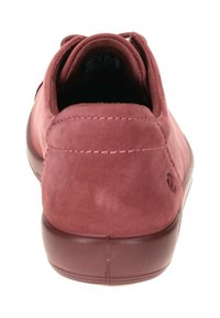 Burgundy suede sneakers with a smooth texture, padded collar, and rubber sole. Features stitching details and side logo accent.