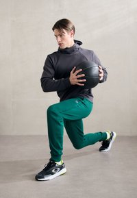 Champion ICONS CUFF PANTS - Treniņtērpa apakšdaļas - green