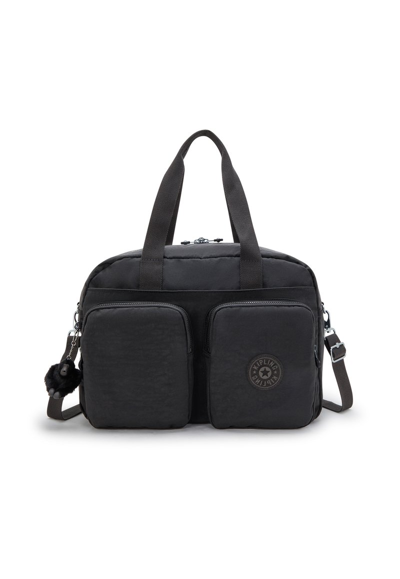 Black nylon duffle bag with dual front zip pockets, short handles, detachable strap, and a furry keychain accent. Features circular logo detail.