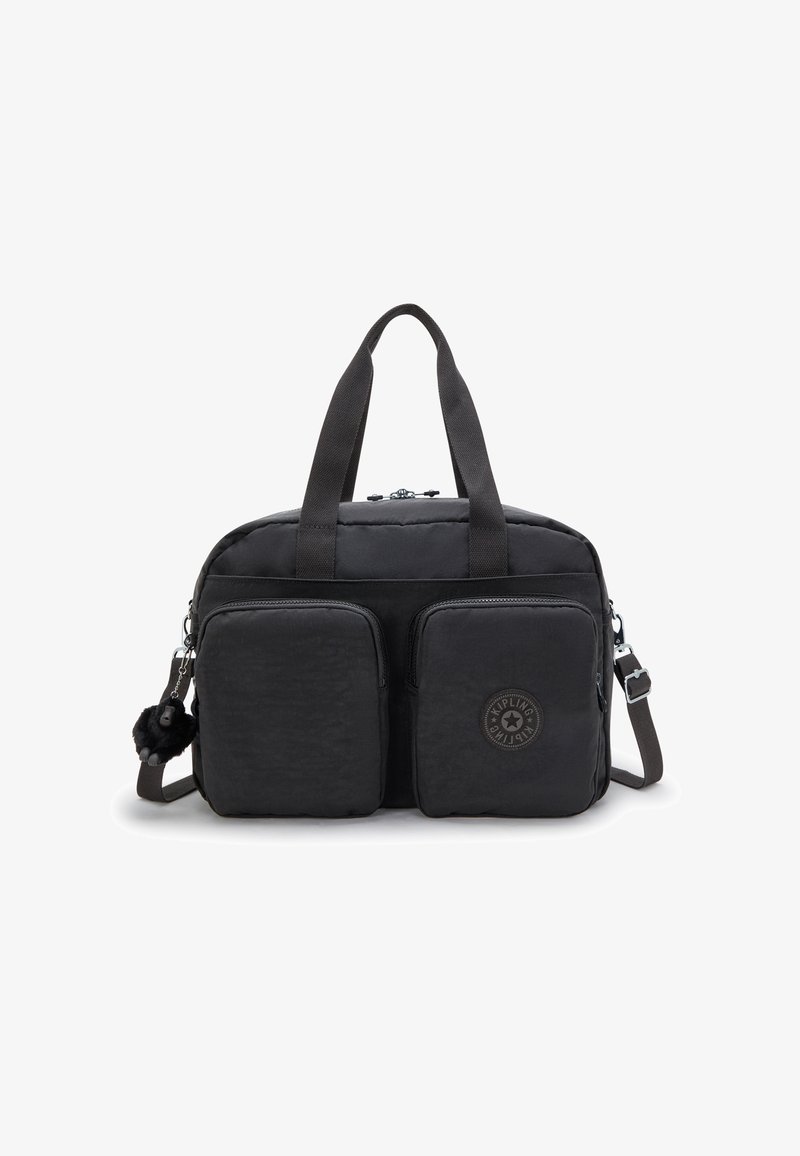 Black nylon duffle bag with dual front zip pockets, short handles, detachable strap, and a furry keychain accent. Features circular logo detail.