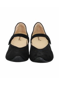 Schwarze Wildlederballerinas mit einer runden Zehenform und einem schmalen Riemen über den Spann. Das Innenfutter ist beige. Die Sohle ist aus schwarzem, leicht konturiertem Gummi.