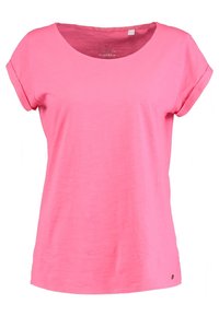 Pink cotton t-shirt med scoop halsudskæring, korte rullede ærmer, løs pasform og en lille logo detalje nær kanten. Glat tekstur.