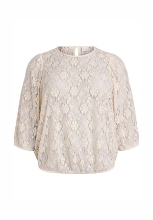 Blusa in pizzo floreale beige con maniche a palloncino a tre quarti, scollatura rotonda e piccola apertura a chiave con bottone sul retro.