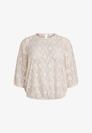 Blusa in pizzo floreale beige con maniche a palloncino a tre quarti, scollatura rotonda e piccola apertura a chiave con bottone sul retro.