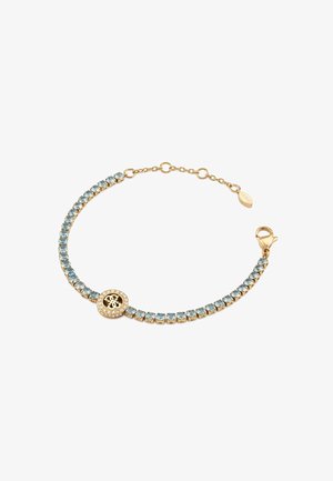 Gouden armband met blauwe edelstenen, voorzien van een ronde logo charm verfraaid met kleine heldere kristallen. Verstelbare ketting met een kreeftsluiting.