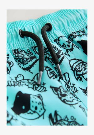 Světle modré plavecké šortky s černými grafickými motivy v linii. Elastický pas s černým šňůrkovým stahováním pro úpravu. Hladká textura látky.