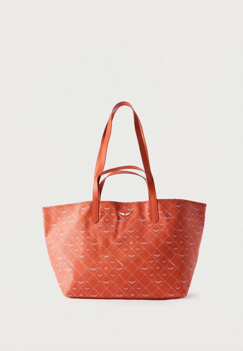 Sac cabas orange avec double poignées et un motif losange subtil composé de petites formes blanches sur un fond uni.
