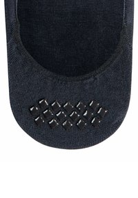 Schwarze rutschfeste Socke mit strukturiertem Grip-Muster an der Unterseite, ausgestattet mit kleinen erhöhten Quadraten für verbesserten Halt und einer glatten gestrickten Oberfläche.