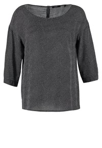 Blouse noire à manches longues avec col rond et petit motif tourbillonnant à petits points blancs, étiquetée Opus.