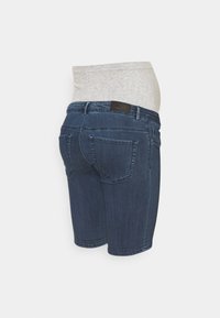Denim shorts with a gray elastic waistband, featuring a mid-rise design, two back pockets, and a dark blue wash. Logo on waistband.