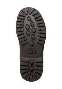 Semelle de botte noire à crampons profonds, présentant un motif de grips rectangulaires arrondis et en forme de croix, avec un logo "HH" embossé au centre.