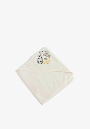 Crème-kleurige babycapuchondoek opgevouwen met geborduurde melkfles, croissant, appel en tekst "Milk Club" op de kap.
