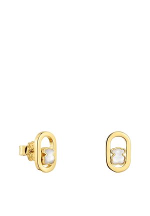 Orecchini a perno ovali in oro con piccole intarsi a forma di fiore bianco posizionati al centro di ogni cornice ovale.