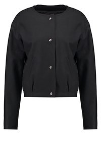 Veste noire à manches longues avec col rond et boutons-pression argentés à l'avant, comprenant deux poches avant et un ourlet cintré.