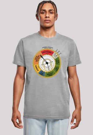 Gray cotton t-shirt featuring a colorful circular graphic with a dial indicating threat levels in red, orange, yellow, and blue text.