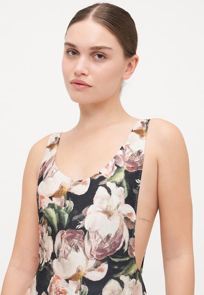 Floral one-piece swimsuit in black, featuring large pink and white peony prints, scoop neckline, and open side design with smooth texture.