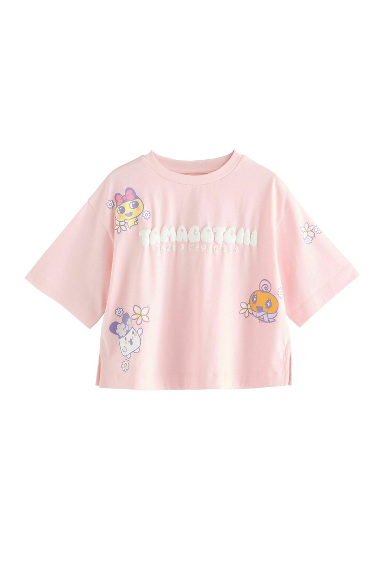Kort lyserød bomulds T-shirt med korte ærmer, der har legende Tamagotchi grafik og blomstrede detaljer; cropped design med sideslids.