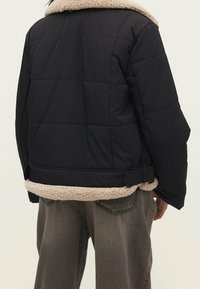 Stradivarius Vinterjakker - black