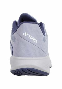 Light purple Yonex athletic shoe with textured upper, reinforced heel, and white logo. Rubber sole features a patterned tread for grip.