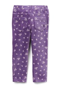 Pantalons en velours côtelé violet avec motifs floraux blancs, cinq poches et détails cousus. Disponibles dans une coupe slim.