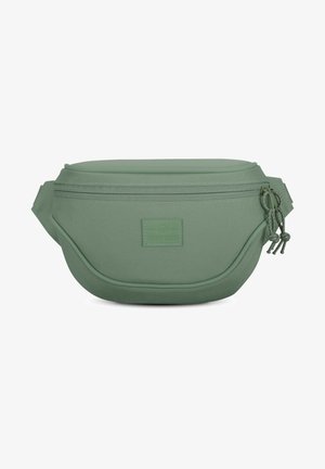 Green fabric fanny pack with curved shape, front zippered pocket, and adjustable strap. Textured material with a small logo patch.