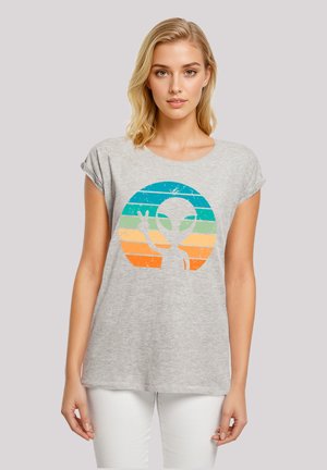 Gray cotton T-shirt with short sleeves featuring a retro alien graphic in teal, green, orange, and yellow stripes within a circular design.