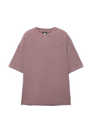 Oversized short-sleeve t-shirt in muted mauve, made of soft cotton, featuring a round neckline and subtle embroidered logo on the chest.