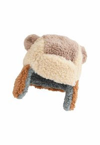 Faux fur hat in cream, brown, and gray tones with plush texture. Features ear flaps and rounded top adorned with small ears.