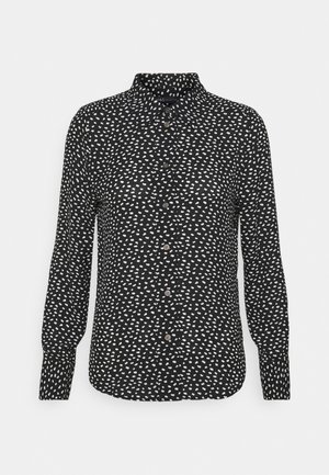 Zwart shirt met lange mouwen met een wit abstract patroon, knoopsluiting en een klassieke kraag. Zachte stof met een gladde textuur.