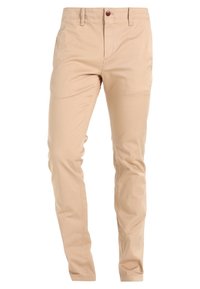 Beige cotton chinos with a straight leg design, featuring a single brown button and front pockets. Smooth texture and no visible patterns.