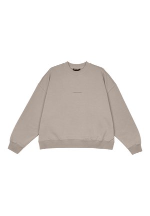 Beige Oversized-Sweatshirt aus weichem Material. Mit Rundhalsausschnitt und gerippten Bündchen sowie Saum. Dezente Branding in der Mitte.