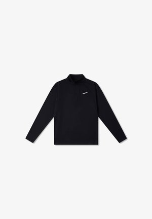 Mustal pitsekaelusega pikkade varrukatega särk sujuvast ja kergest materjalist. Omab nii rinna kohal diskreetset logo kui ka voolujoonelist disaini raglaanvarrukatega.