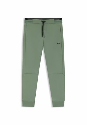Ljusgröna joggers med elastisk midja, snörning, sidofickor och ribbade mudd. Har en liten svart "BOSS"-logotyp.