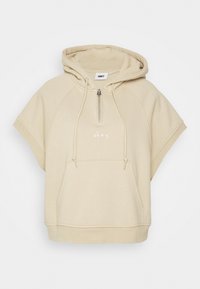 Beige zkrácená mikina s kapucí a zipovým výstřihem, oversized rukávy a přední kapsou. Na hrudi je bílý vyšitý nápis "obey".