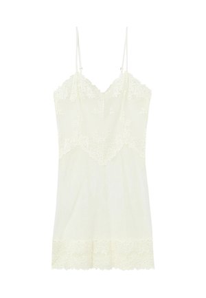 Lace-trimmed nightdress in cream, featuring a textured bodice, adjustable straps, and a scalloped hem with floral lace accents.