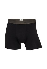 Sorte boxer briefs med en glat tekstur, der har en kontrasterende mørkegrøn elastisk talje med teksten "MADS NØRGAARD."