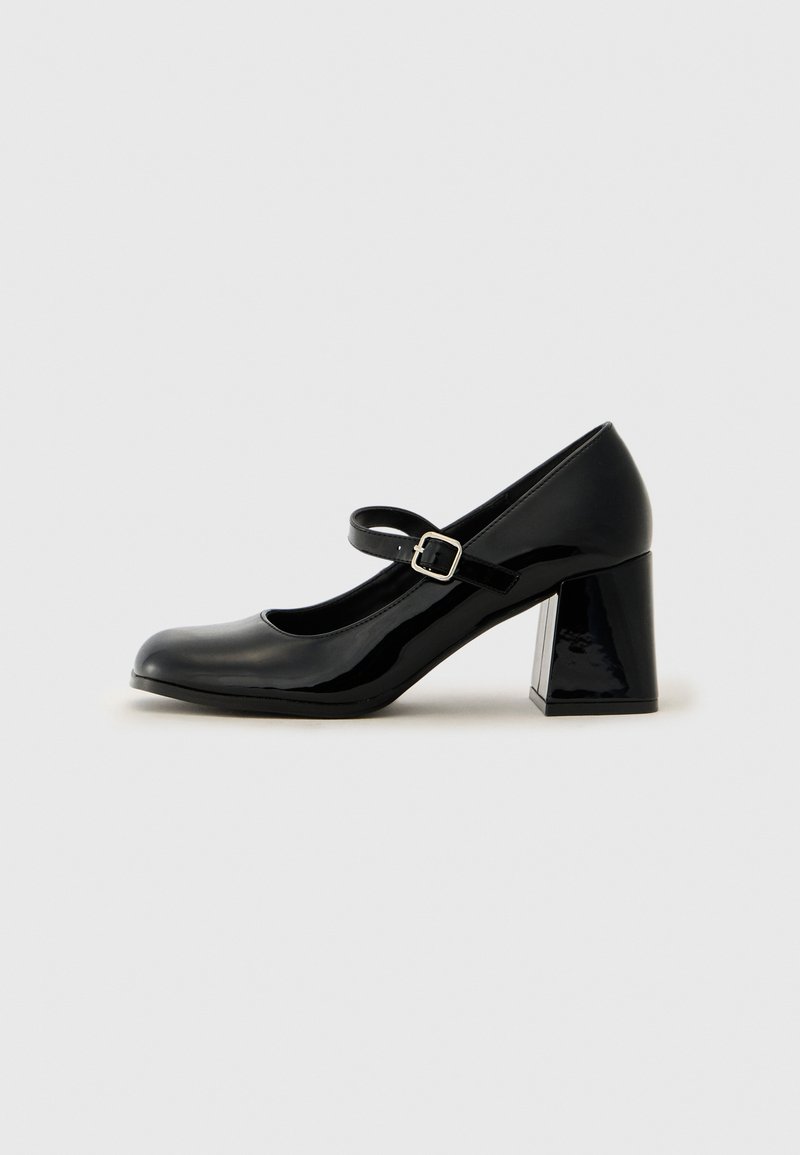 Black patent leather Mary Jane shoe with a rounded toe, adjustable strap, and a chunky rectangular heel. Smooth texture with a shiny finish.