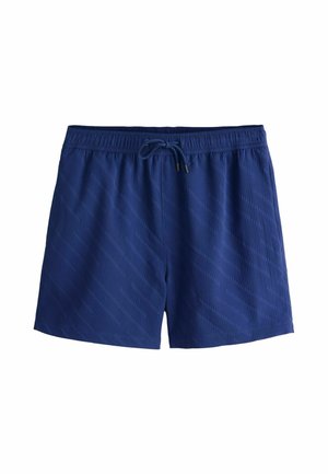 Granatowe spodenki kąpielowe z elastycznym pasem, sznurkiem do ściągania oraz ukośnym teksturowanym wzorem na całej powierzchni. Materiał jest lekki i gładki.